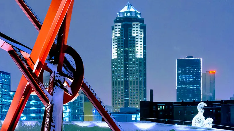 Downtown Des Moines skyline at dusk seen from a rooftop