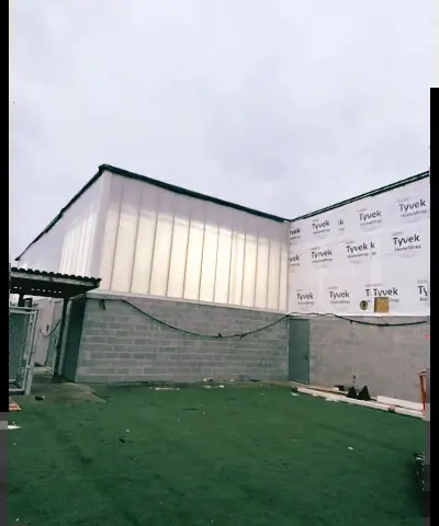 Translucent wall panel system on the upper wall of a new building